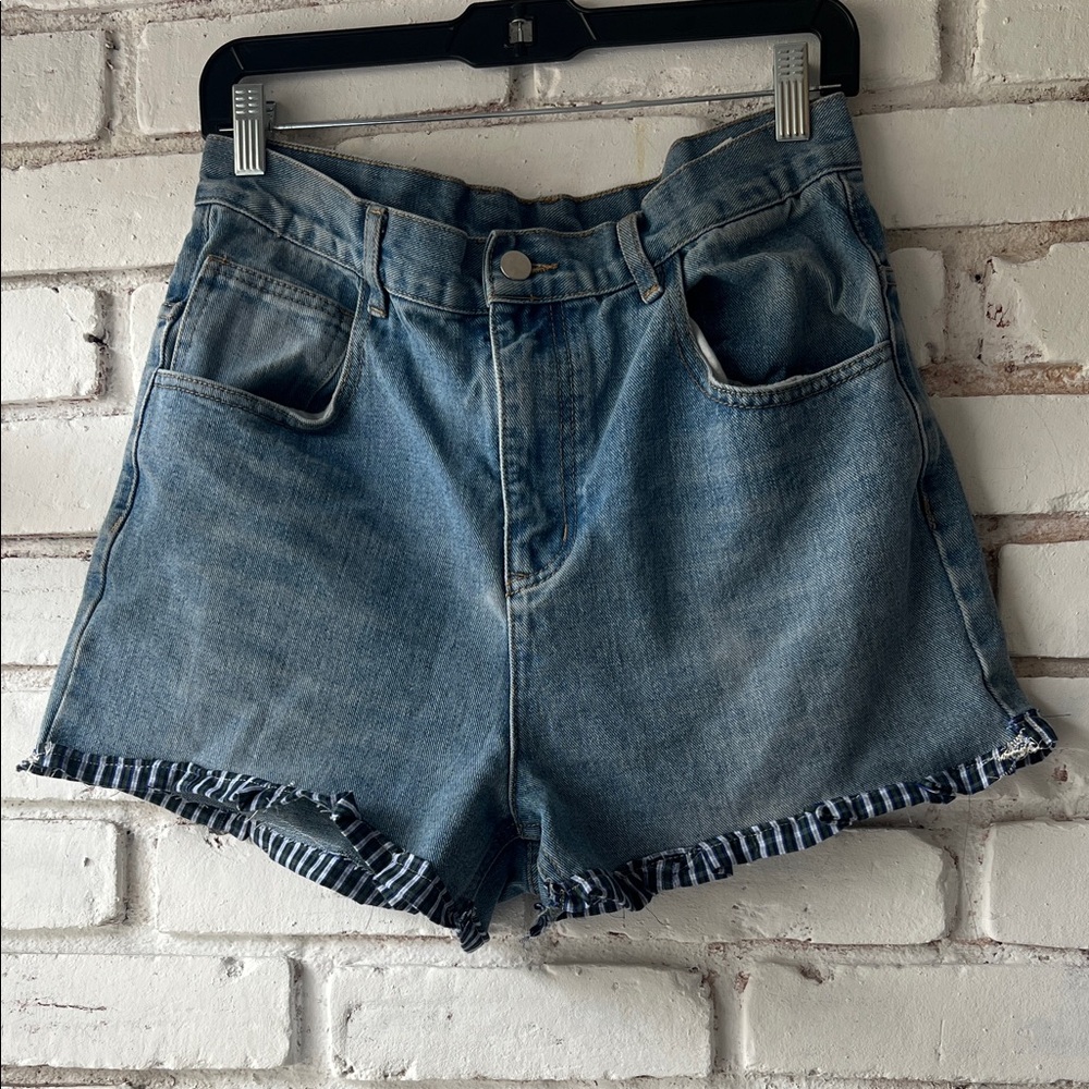 High-Waist Denim Shorts in Light Blue with ruffle hem